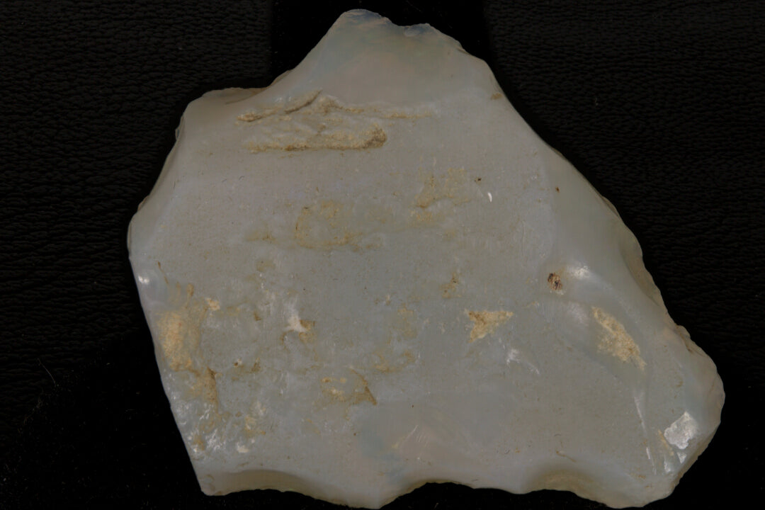 Rough Andamooka Opal from Australia on a black background