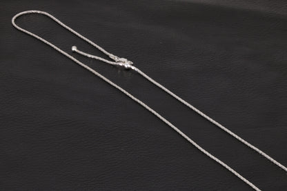 Adjustable Sterling Silver Chain on a black background