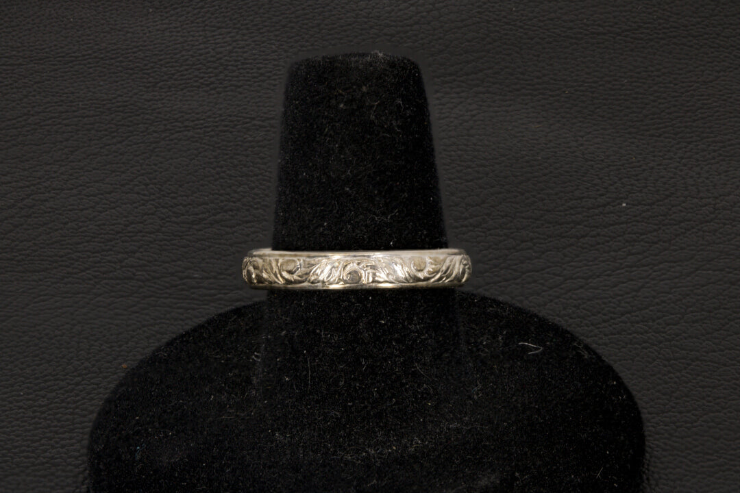 Amethyst oval ring with decorative ring band prong set in sterling silver on a black stand band view only