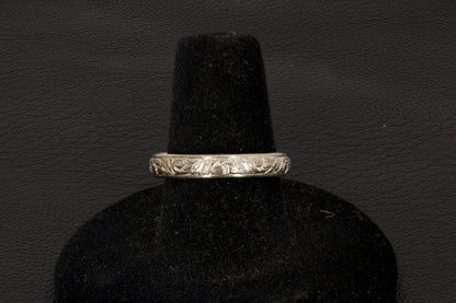 Amethyst oval ring with decorative ring band prong set in sterling silver on a black stand band view only