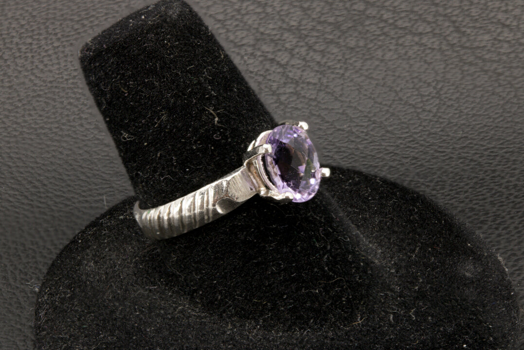 Beautiful oval cut Amethyst ring set in sterling silver with banded ring band, size 7 left side photo