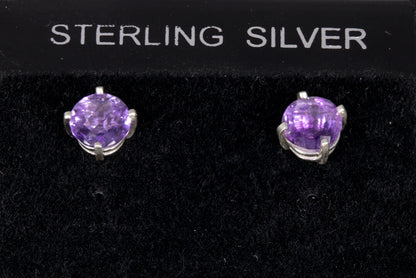 Amethyst Earrings set in a sterling silver double basket prong set front view in holder