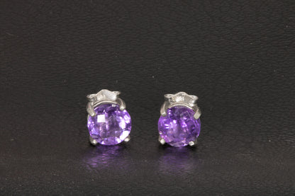 Amethyst Earrings set in a sterling silver double basket prong set  front view