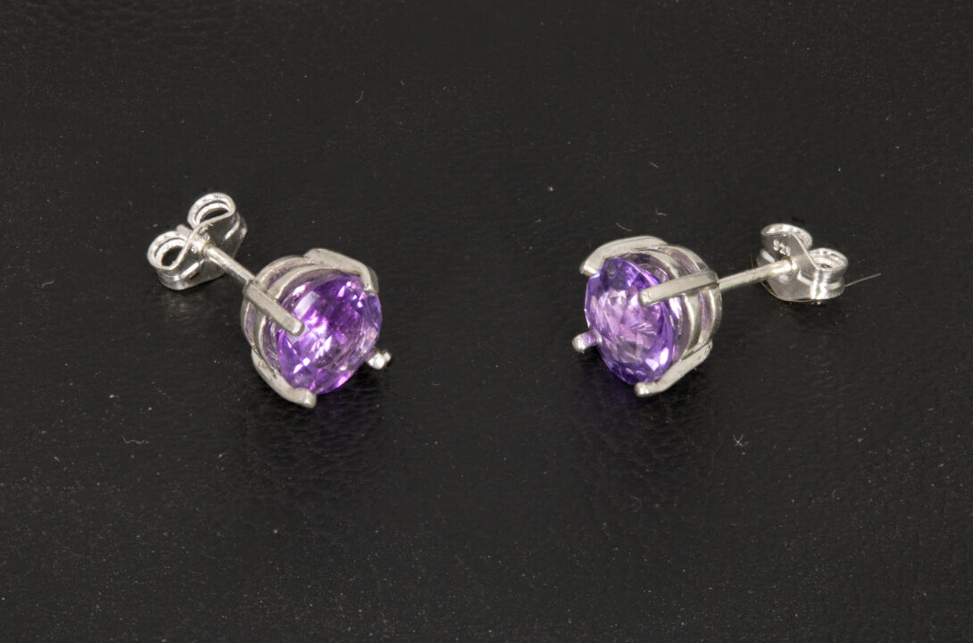 Amethyst Earrings set in a sterling silver double basket prong set side view