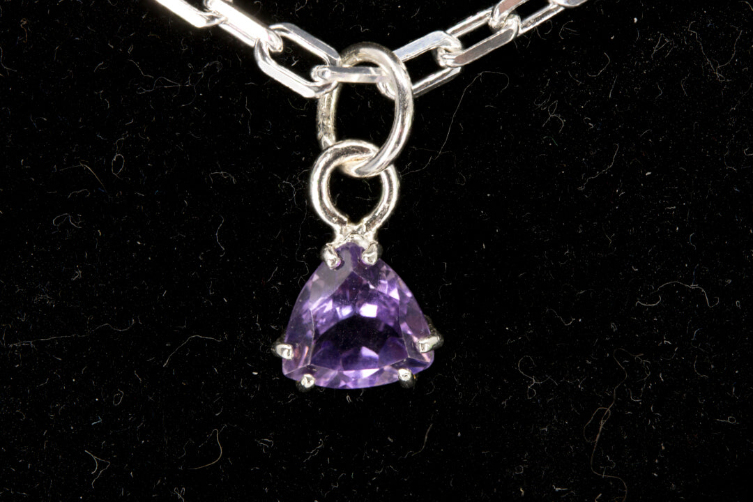 Amethyst trillion facet set in a sterling silver pendant front photo