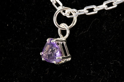 Amethyst trillion facet set in a sterling silver pendant right side photo