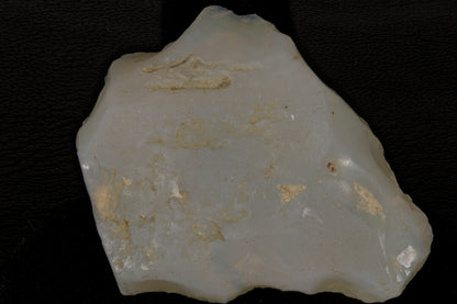 Rough Andamooka Opal from Australia on a black background