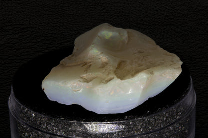 Rough Andamooka Opal from Australia on a black background