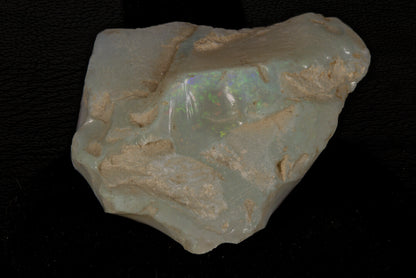 Rough Andamooka Opal from Australia on a black background