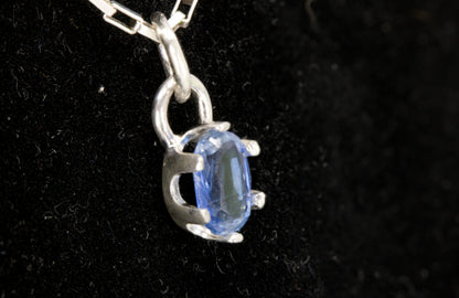 Natural Faceted Oval-Cut Royal Blue Kyanite Pendant set in Sterling Silver. 2.1 ct. stone. Left side view picture.