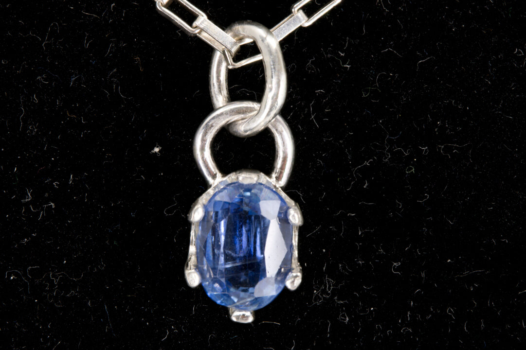 Natural Faceted Oval-Cut Royal Blue Kyanite Pendant set in Sterling Silver. 2.1 ct. stone. front view picture.