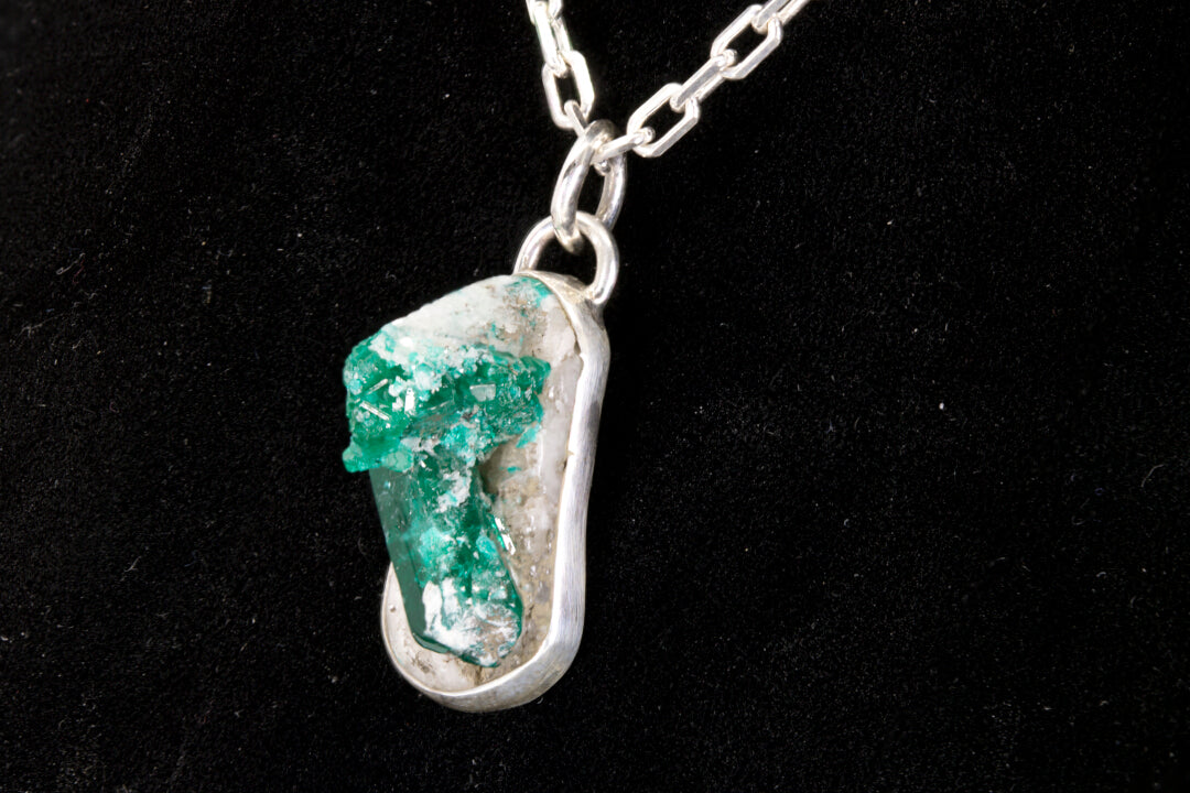 Green Apatite crystal Pendant stuck in its natural white rock matrix set in a sterling silver