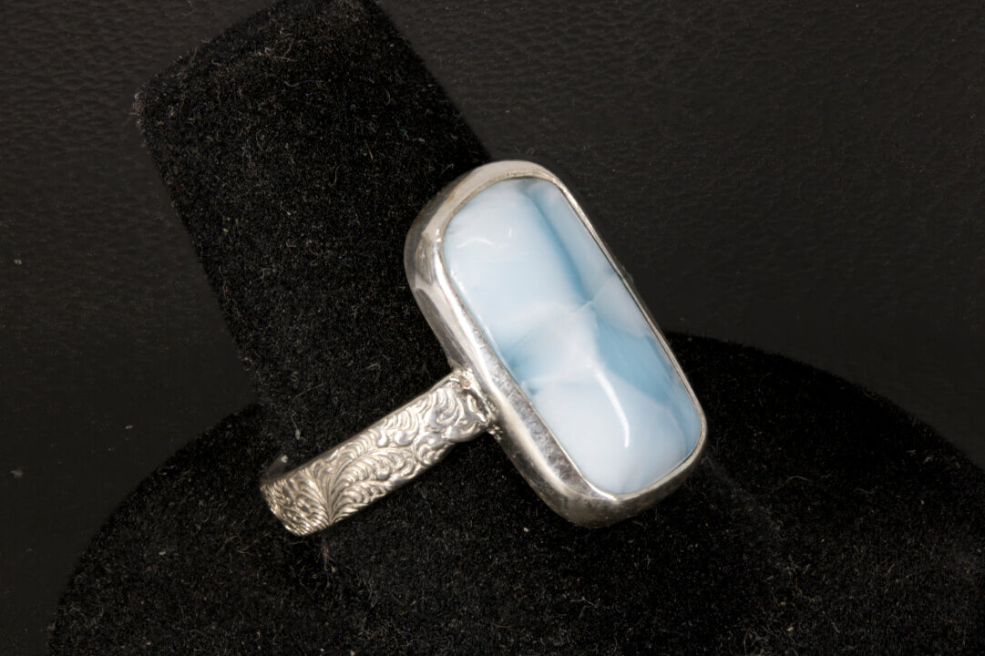 Chatoyant Larimar ring with decorative ring band left side view