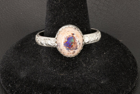 Mexican Cantera Opal set in a decorative sterling silver ring band front photo