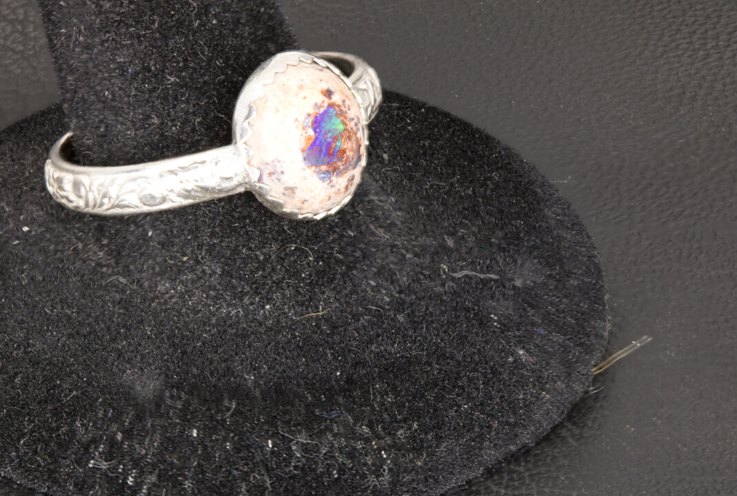 Mexican Cantera Opal set in a decorative sterling silver ring band left photo