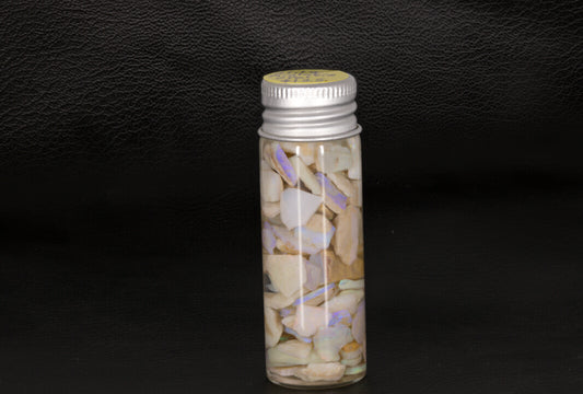 Mintabie rough Opal chips and small stones in a small jar
