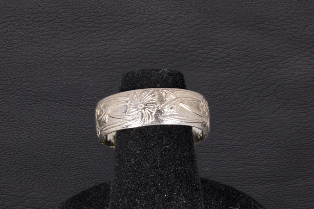 Blue Azurite Oval Ring with decorative flower ring band set in sterling silver on a black background back