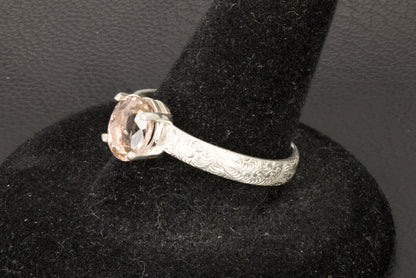 Peach Tourmaline oval facet set in a decorative sterling silver ring band right photo