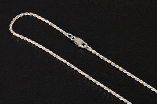 Sterling silver rope chain on a black background