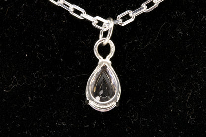 Rose Quartz pear shaped facet set in sterling silver back photo