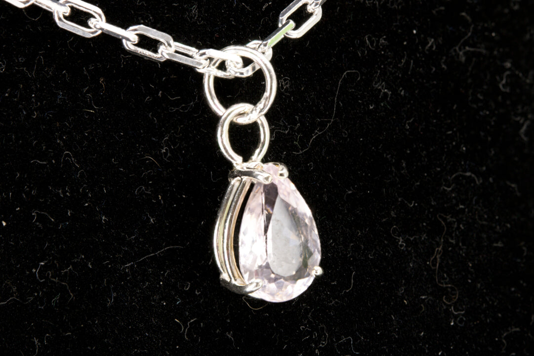 Rose Quartz pear shaped facet set in sterling silver left photo