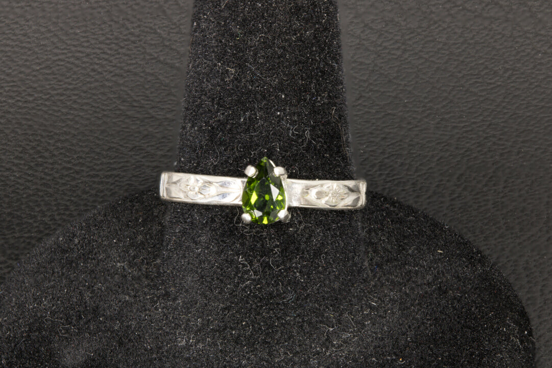 Tsavorite Garnet set in a sterling silver flower ring band front photo