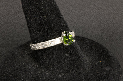 Tsavorite Garnet set in a sterling silver flower ring band left side photo