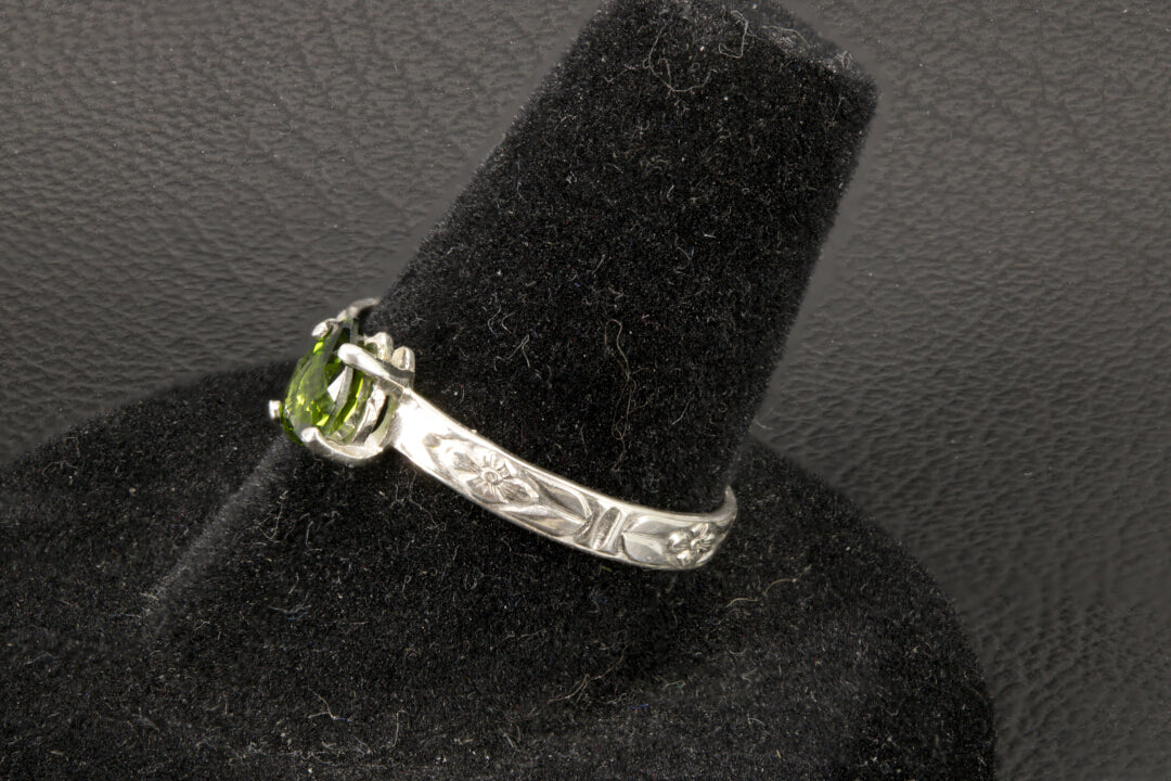 Tsavorite Garnet set in a sterling silver flower ring band right side photo