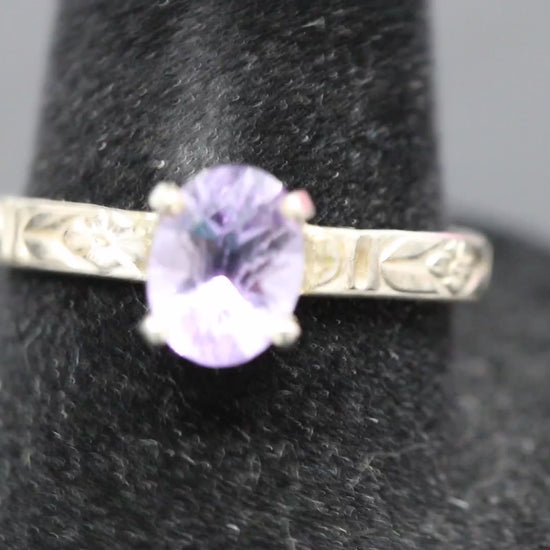 Faceted oval cut Amethyst ring set in sterling silver with a flower ring band, size 8.5 back and forth video